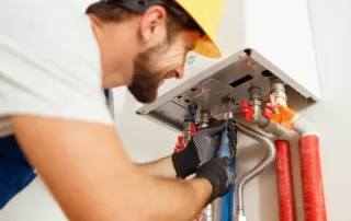 plumber repairing a water heater