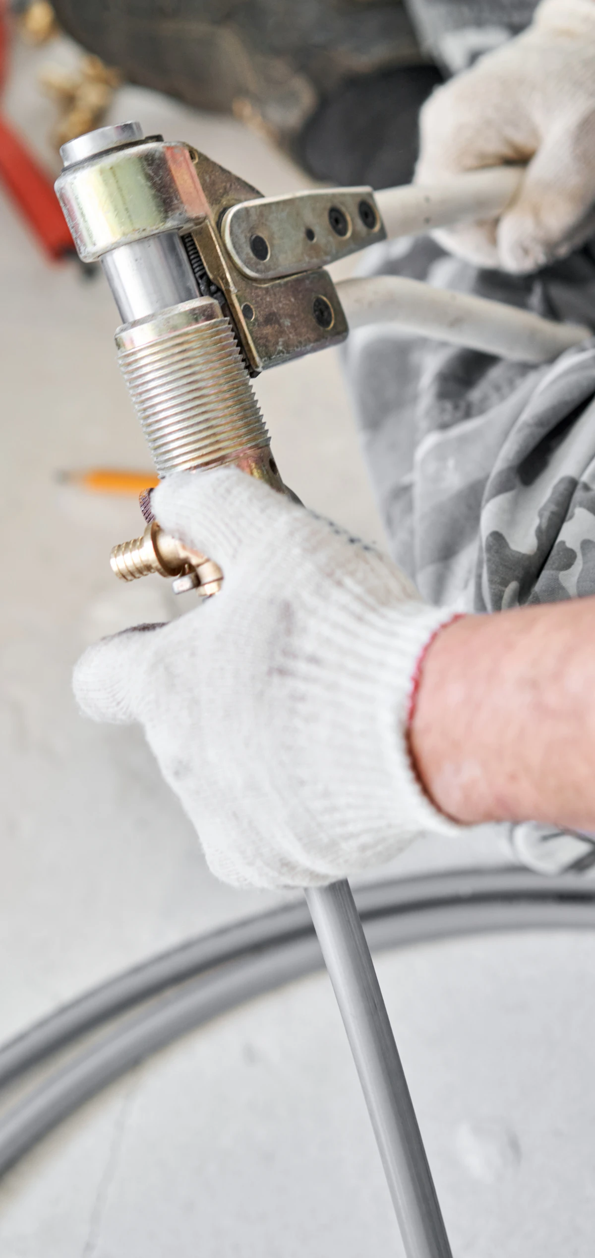 A plumber in Boerne, TX working on a home's plumbing system.