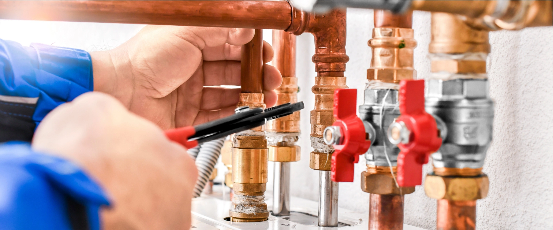 A plumber in Boerne working on a gas plumbing system.